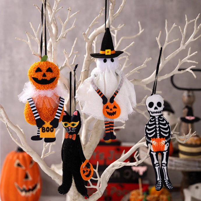 Halloween-themed decorations including a pumpkin, ghost, cat, and skeleton hanging from branches. These adorable Halloween Decorative Hangings Dolls by Allthingscurated spark joy and give your Holiday decor a fun and eerie vibe.