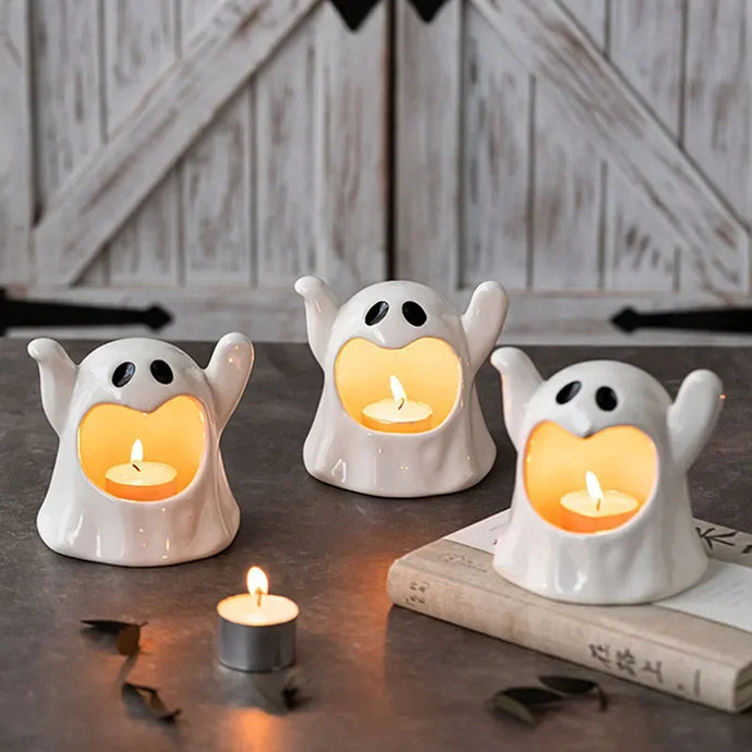 Happy Ghost Candle Holder by Allthingscurated is made from high-quality porcelain with a cute ghost design. Perfect for holding tealight candles. Group several holders together to create a cozy and fun atmosphere during Halloween. 