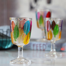 Load image into Gallery viewer, Havana Embossed Leaves Vintage Goblets by Allthingscurated, featuring contrasting multi-colored leaves embossed onto lead-free glass vessel. Charming with a touch of vintage vibe.  Shown here is the glass with a clear stem and base.
