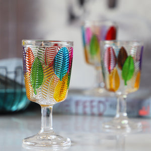 Havana Embossed Leaves Vintage Goblets by Allthingscurated, featuring contrasting multi-colored leaves embossed onto lead-free glass vessel. Charming with a touch of vintage vibe.  Shown here is the glass with a clear stem and base.