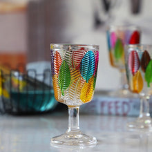 Load image into Gallery viewer, Havana Embossed Leaves Vintage Goblets by Allthingscurated, featuring contrasting multi-colored leaves embossed onto lead-free glass vessel. Charming with a touch of vintage vibe.  Shown here is the glass with a clear stem and base.
