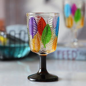 Havana Embossed Leaves Vintage Goblets by Allthingscurated, featuring contrasting multi-colored leaves embossed onto lead-free glass vessel. Charming with a touch of vintage vibe. Shown here is the glass with the dark brown stem and base.