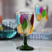 Load image into Gallery viewer, Havana Embossed Leaves Vintage Goblets by Allthingscurated, featuring contrasting multi-colored leaves embossed onto lead-free glass vessel. Charming with a touch of vintage vibe. Shown here is the glass with the green stem and base.
