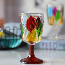 Load image into Gallery viewer, Havana Embossed Leaves Vintage Goblets by Allthingscurated, featuring contrasting multi-colored leaves embossed onto lead-free glass vessel. Charming with a touch of vintage vibe.  Shown here is the glass with the red stem and base.
