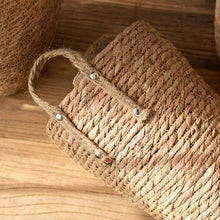Load image into Gallery viewer, Hayden Tall Planters by Allthingscurated come in 3 sizes. Hand-woven using natural seagrass and comes with handles for easy transportation.
