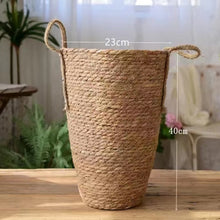 Load image into Gallery viewer, Hayden Tall Planters by Allthingscurated come in 3 sizes. Hand-woven using natural seagrass and comes with handles for easy transportation.  Featured here is a large size planter measuring height 15.6 inches and diameter of 23cm or 9 inches.40cm or
