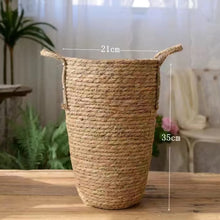 Load image into Gallery viewer, Hayden Tall Planters by Allthingscurated come in 3 sizes. Hand-woven using natural seagrass and comes with handles for easy transportation.  Featured here is a medium size planter measuring height of 35cm or 13.7 inches and diameter of 21cm or 8.2 inches.
