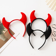 Load image into Gallery viewer, Horn Shape Headband by Allthingscurated features trendy, three-dimensional horns that is fun and perfect for elevating your Halloween party look. This accessory is perfect for adding a playful touch to your costume and make a statement at any Halloween party. Comes in 3 colors.
