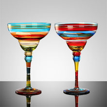 Load image into Gallery viewer, Ibiza Party Cocktail Glasses by Allthingscurated are available in 7 eclectic designs. Each cup is hand-painted and hand drawn to reflect its individual personality and creativity. Each cup has a capacity of 270ml or 9 ounce.

