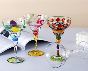 Ibiza Party Cocktail Glasses by Allthingscurated are available in 7 eclectic designs. Each cup is hand-painted and hand drawn to reflect its individual personality and creativity. Each cup has a capacity of 270ml or 9 ounce.