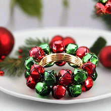 Load image into Gallery viewer, Jingle Bells Napkin Rings by Allthingscurated. Come as a set of 6 rings in color combos of red and green, or silver and gold, they are the perfect finishing touch for your holiday table setting. Spread the joy of Christmas and charm your guests with the cheerful bells.
