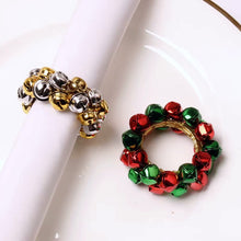 Load image into Gallery viewer, Jingle Bells Napkin Rings by Allthingscurated. Come as a set of 6 rings in color combos of red and green, or silver and gold, they are the perfect finishing touch for your holiday table setting. Spread the joy of Christmas and charm your guests with the cheerful bells.
