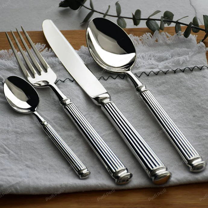 Julius Silver Stainless Steel Flatware Sets by Allthingscurated are crafted from high-quality 18/10 stainless steel. The weighty and solid construction provides a luxurious feel, while the Roman column handle design adds a touch of elegance. The mirror polished surface reflects a bright and shiny finish, adding a touch of sophistication to any table.