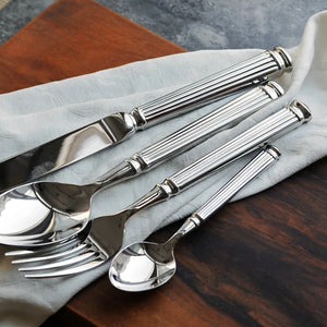Julius Silver Stainless Steel Flatware Sets by Allthingscurated are crafted from high-quality 18/10 stainless steel. The weighty and solid construction provides a luxurious feel, while the Roman column handle design adds a touch of elegance. The mirror polished surface reflects a bright and shiny finish, adding a touch of sophistication to any table.
