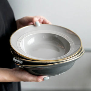 Kovan Ceramic Pasta/Soup Bowl by Allthingscurated is a stylish and functional bowl that offers versatility and practicality in usage. Perfectly sized for pasta, soups, stews, desserts and more. It’s a must-have addition to your dinnerware collection for all occasions from formal dining to everyday casual meals. Comes in gray and black.