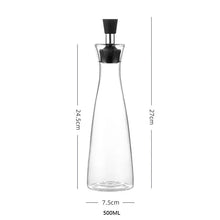 Load image into Gallery viewer, Glass Bottle Oil Dispensers by Allthingscurated spot a streamlined design with leak-proof silicone nozzle that ensure easy and mess-free pouring and drizzling. Comes with a cover to keep contents fresh and free from dust. Comes in large and small bottle that are just perfect for drizzling over salads or using in daily cooking. Featured here is the Large Oil Dispenser in 500ml or 17 fluid ounce.
