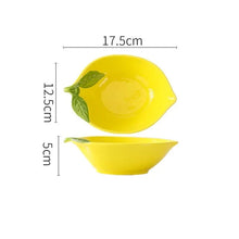 Load image into Gallery viewer, Summertime Lemon Shape Dinnerware by Allthingscurated will brighten any meal with its bright, cheery color. Made from high quality porcelain, they are perfect for adding color and interest to your Sunday brunch to outdoor picnics, and brighten up your summer tablescape. Featured here is the serving bowl.
