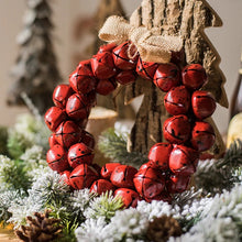 Load image into Gallery viewer, Christmas Jingle Bells Wreath by Allthingscurated comes in 3 semi-matte colors of Red, Multi Colors and Gold. The Multi Color Wreath features clusters of bell in green, red, ivory and brown. Each wreath is formed of bells made of iron entwined onto a jute rope and truly jingle with each movement. Measures approximately 18cm or 7 inches in width and height.
