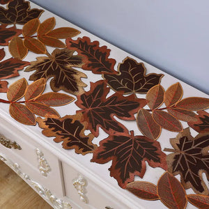 Autumn Maple Leaf Placemat and Table Runner by Allthingscurated featured detailed embroidery design of maple leaves in a beautiful spectrum of colors from light brown, to orangey and reddish hues. Perfect for creating a stunning autumnal table setting and adding a refined autumn touch to your living space and autumn-themed home décor.