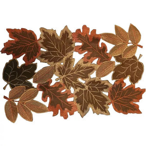 Autumn Maple Leaf Placemat and Table Runner by Allthingscurated featured detailed embroidery design of maple leaves in a beautiful spectrum of colors from light brown, to orangey and reddish hues. Perfect for creating a stunning autumnal table setting and adding a refined autumn touch to your living space and autumn-themed home décor. Seen here is the maple leaf-patterned placemat.