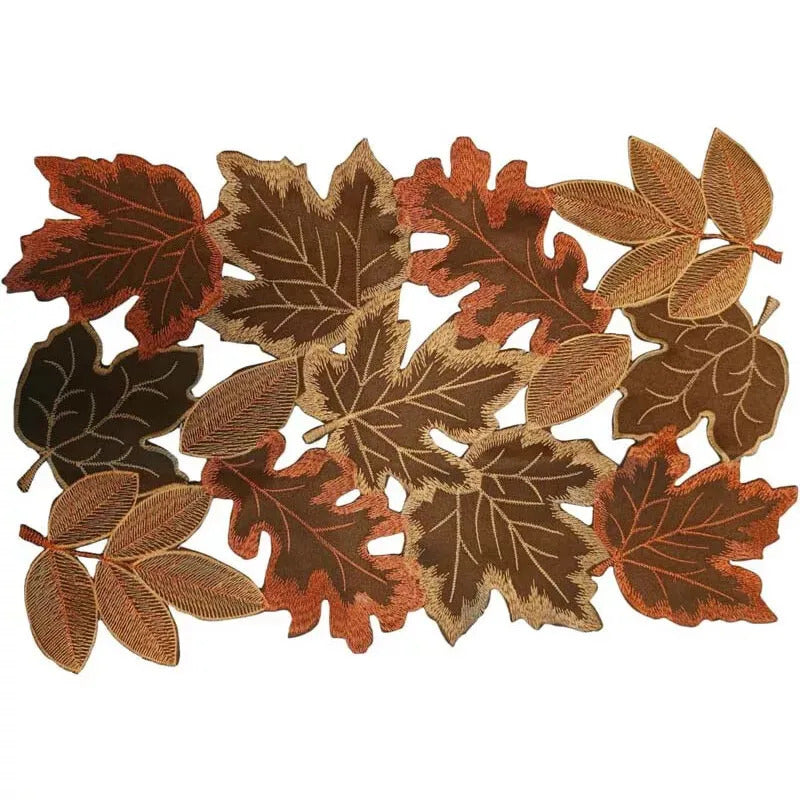 Autumn Maple Leaf Placemat and Table Runner by Allthingscurated featured detailed embroidery design of maple leaves in a beautiful spectrum of colors from light brown, to orangey and reddish hues. Perfect for creating a stunning autumnal table setting and adding a refined autumn touch to your living space and autumn-themed home décor. Seen here is the maple leaf-patterned placemat.