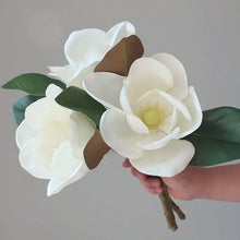Load image into Gallery viewer, Faux Large White Magnolia by Allthingscurated is expertly crafted with realistic details to look as good as the real thing. It’s a gorgeous addition to your home décor and stays beautiful and pretty all year round. Its grand size makes it perfect as a single flower but creates a dramatic effect when arranged in a bunch. Measures 40cm or 15.6 inches in height and 18cm or 7 inches in width.
