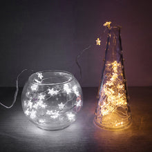 Load image into Gallery viewer, Mini Stars LED Fairy Lights by Althingscurated. Create a cozy and festive atmosphere with these decorative lights that offer a warm, tinkling glow. These mini stars are attached to silver wire that is bendable and easy to manipulate so you can fit them into tiny spaces or wrap around objects to enhance your favorite decorations.  Comes in 6 different lengths from 1 meters to 6 meters or 39 to 236 inches. Available in warm white or white lights.

