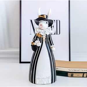Our Regal Rabbit Family Figurines by Allthingscurated are beautifully-crafted and decorative. Made high-quality resin, these unique figurines will add a touch of elegance and whimsy to your home décor. Available in 6 designs, they are the perfect additions to your spring and Easter decorations. Featured here is Mrs Rabbit.