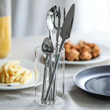 Load image into Gallery viewer, Neptune 4-piece Flatware Set by Allthingscurated beautifully blends mythical design with modern construction. Made from high-quality 18/10 stainless steel with a sleek mirror polishing for a modern look. Inspired by Poseidon’s Trident, the dinner fork is expertly shaped to resemble the 3-pronged spear. Unique and elegant, the place setting comes in silver, gold, rose gold, black and colorful rainbow and each set consists of a dinner spoon, dinner fork, dinner knife and a small spoon.
