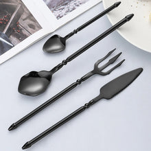 Load image into Gallery viewer, Neptune 4-piece Flatware Set by Allthingscurated beautifully blends mythical design with modern construction. Made from high-quality 18/10 stainless steel with a sleek mirror polishing for a modern look. Inspired by Poseidon’s Trident, the dinner fork is expertly shaped to resemble the 3-pronged spear. Unique and elegant, the place setting comes in silver, gold, rose gold, black and colorful rainbow and each set consists of a dinner spoon, dinner fork, dinner knife and a small spoon.
