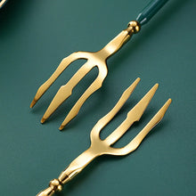 Load image into Gallery viewer, Neptune 4-piece Colored Handle Luxury Flatware Set by Allthingscurated beautifully blends mythical design with modern construction. Made from high-quality 18/10 stainless steel with a sleek mirror polishing for a modern look. Inspired by Poseidon’s Trident, the dinner fork is expertly shaped to resemble the 3-pronged spear. This place setting comes in Gold with either black, white, turquoise blue and green handle. Each set consists of a dinner spoon, dinner fork, dinner knife and a small spoon.
