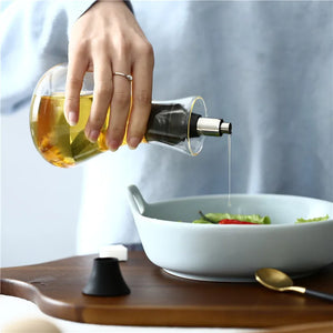 Glass Bottle Oil Dispensers by Allthingscurated spot a streamlined design with leak-proof silicone nozzle that ensure easy and mess-free pouring and drizzling. Comes with a cover to keep contents fresh and free from dust. Comes in large and small bottle that are just perfect for drizzling over salads or using in daily cooking.
