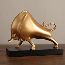 Load image into Gallery viewer, The Oscar Bull Sculpture by Allthingscurated spots an abstract and contemporary design in a matte gold finish. This stunning piece makes the perfect gift for those born under the zodiac ox sign and Taurus. It not only serves as a beautiful display but also adds a touch of personality. 
