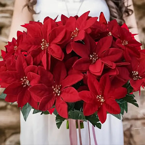 Bouquet of red poinsettias with a blurred background. Bring the true spirit of the holidays into your home with this bundle of 5 classic red Faux Poinsettia by Allthingscurated. These timeless blooms complement any festive palette and instantly evokes Christmas cheer.
