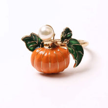 Load image into Gallery viewer, Faux Pearl Pumpkin Rings by Allthingscurated come in a set of 6 napkin rings. Each ring is crafted with exquisite detail of a pumpkin design and adorned with a faux pearl to bring a touch of sophistication. Perfect for all fall festivities, from Halloween to Thanksgiving.
