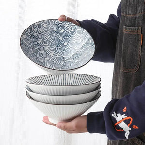 This Blue and White Japanese Ramen Bowls by Allthingscurated feature a modern, Asian design in a conical shape with a white fluted exterior, the porcelain bowls spot a beautiful, Japanese-inspired print for the interior. Comes in 4 different designs, this versatile bowl is not just for ramen, but also great for soups, curries and salads.