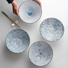 Load image into Gallery viewer, This Blue and White Japanese Ramen Bowls by Allthingscurated feature a modern, Asian design in a conical shape with a white fluted exterior, the porcelain bowls spot a beautiful, Japanese-inspired print for the interior. Comes in 4 different designs, this versatile bowl is not just for ramen, but also great for soups, curries and salads.
