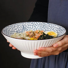 Load image into Gallery viewer, This Blue and White Japanese Ramen Bowls by Allthingscurated feature a modern, Asian design in a conical shape with a white fluted exterior, the porcelain bowls spot a beautiful, Japanese-inspired print for the interior. Comes in 4 different designs, this versatile bowl is not just for ramen, but also great for soups, curries and salads.
