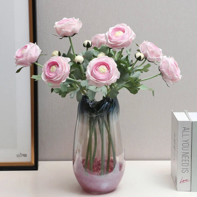 Silk Ranunculus by Allthingscurated are perfect for creating stunning table displays and wedding bouquets. Come in 4 beautiful colors, they add a touch of timelessness and beauty to every home.  Refresh your living space effortlessly with these gorgeous florals that come in a pack of 4 stalks.