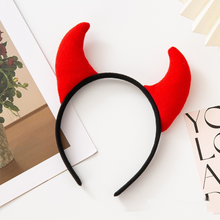 Load image into Gallery viewer, Horn Shape Headband by Allthingscurated features trendy, three-dimensional horns that is fun and perfect for elevating your Halloween party look. This accessory is perfect for adding a playful touch to your costume and make a statement at any Halloween party. Comes in 3 colors. Featured here is the Red Back headband.
