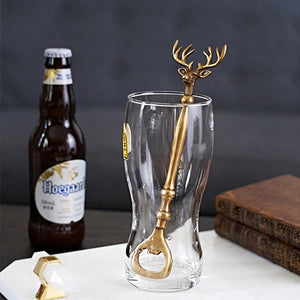 Brass Reindeer Bottle Opener by Allthingscurated.  Crafted from brass and designed with a long handle and an ornamental reindeer head—it is an eye-catching bar tool and charming accessory for Christmas and beyond.