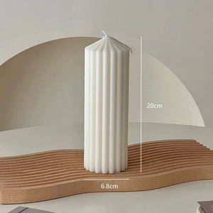 White Ribbed Column Candles by Allthingscurated are made of 100% soy wax. Hand crafted with vertical ridged pattern for texture, these candles are scented with the sweet smell of white rose. Available in 2 sizes. Featured here is the tall candle.