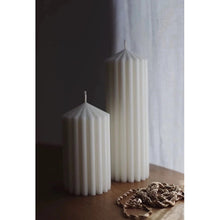 Load image into Gallery viewer, White Ribbed Column Candles by Allthingscurated are made of 100% soy wax. Hand crafted with vertical ridged pattern for texture, these candles are scented with the sweet smell of white rose. Available in 2 sizes.
