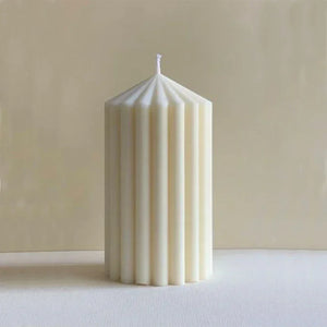 White Ribbed Column Candles by Allthingscurated are made of 100% soy wax. Hand crafted with vertical ridged pattern for texture, these candles are scented with the sweet smell of white rose. Available in 2 sizes.