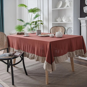 Introducing Ruffled Cotton Tablecloth by Allthingscurated. Made from 100% cotton, our tablecloth exudes French country charm with its romantic, frilly ruffles. With the perfect balance of decorative and laid-back, they have a welcoming and comforting vibe. Available in 8 solid colors. Featured here is the Rust Beige color.