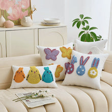 Load image into Gallery viewer, Decorative pillows with embroidered animals on a beige sofa. Spring Melody Embroidered Cushion Covers by Allthingscurated feature charming seasonal details to transition your home into Spring and Easter effortlessly. Each cover showcases meticulous embroidery to add depth and visual interest to your sofa and furniture.

