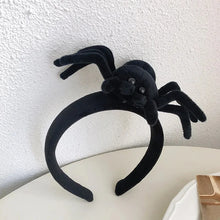 Load image into Gallery viewer, Featuring 3 cute designs, Plush Halloween Headbands by Allthingscurated blend comfort with style. They add a charming touch to your costume and create joyful photo moments to capture the festive spirit.
Seen here is Black spider design headband on a white surface.
