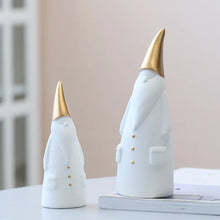 Load image into Gallery viewer, Not your typical jolly Santa Clauses with a plush red suit and rounded belly, this Nordic Santa Claus Figurines Set by Allthingscurated featured 3 porcelain figures of Santa Claus dressed in long white gown and a gold pointed hat. With subtle, understated elegance, they are perfect decoration to add to your Christmas collection to create an enchanting display. Figurines come in 3 different heights of 15cm, 20cm and 23cm or 6 inches, 7.8 inches and 9 inches.
