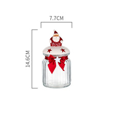 Load image into Gallery viewer, Christmas Festive Storage Jars by Allthingscurated are the perfect jars to keep all your festive treats fresh and delicious. The jars are airtight and each jar is topped with a ceramic lid decorated with a Santa Claus, Christmas Tree, Penguin, Gnome or Fox. Comes in 2 sizes with capacity of 300ml or 10 ounce and 1000ml or 34 ounce. Featured here is a small Santa Claus jar.
