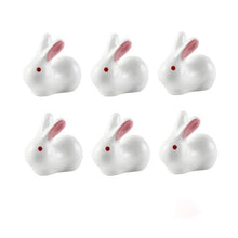 Load image into Gallery viewer, Enhance your Asian dining experience with our Ceramic Rabbit Chopstick Rests by Allthingscurated. These pieces will bring a playful edge to your table with their ability to keep your chopsticks clean and secure. This is a set of 6 pieces.
